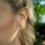 CC Sport Gold Tennis Ball Earrings Close Up